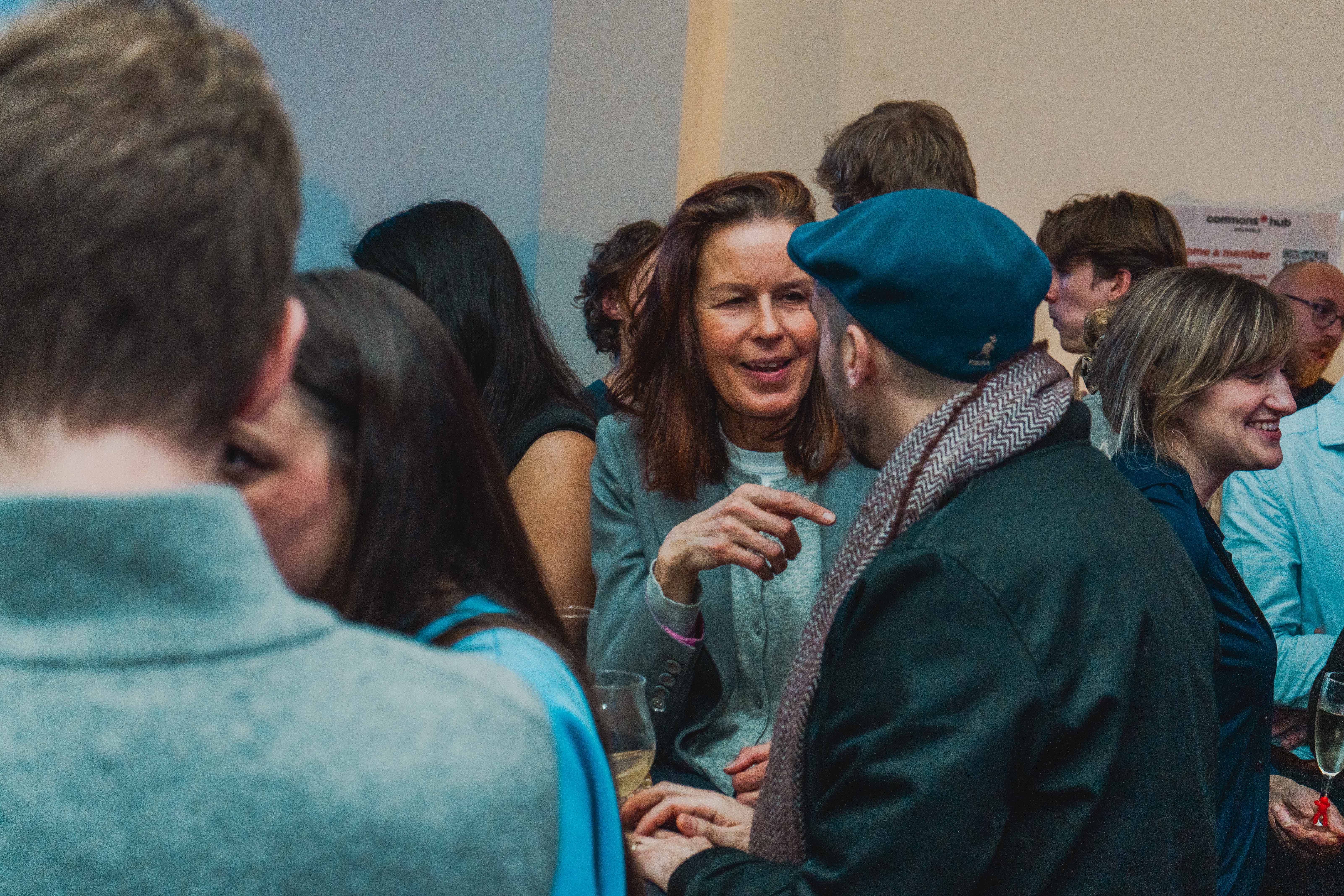 BLOCK25 networking - attendees engaged in conversation